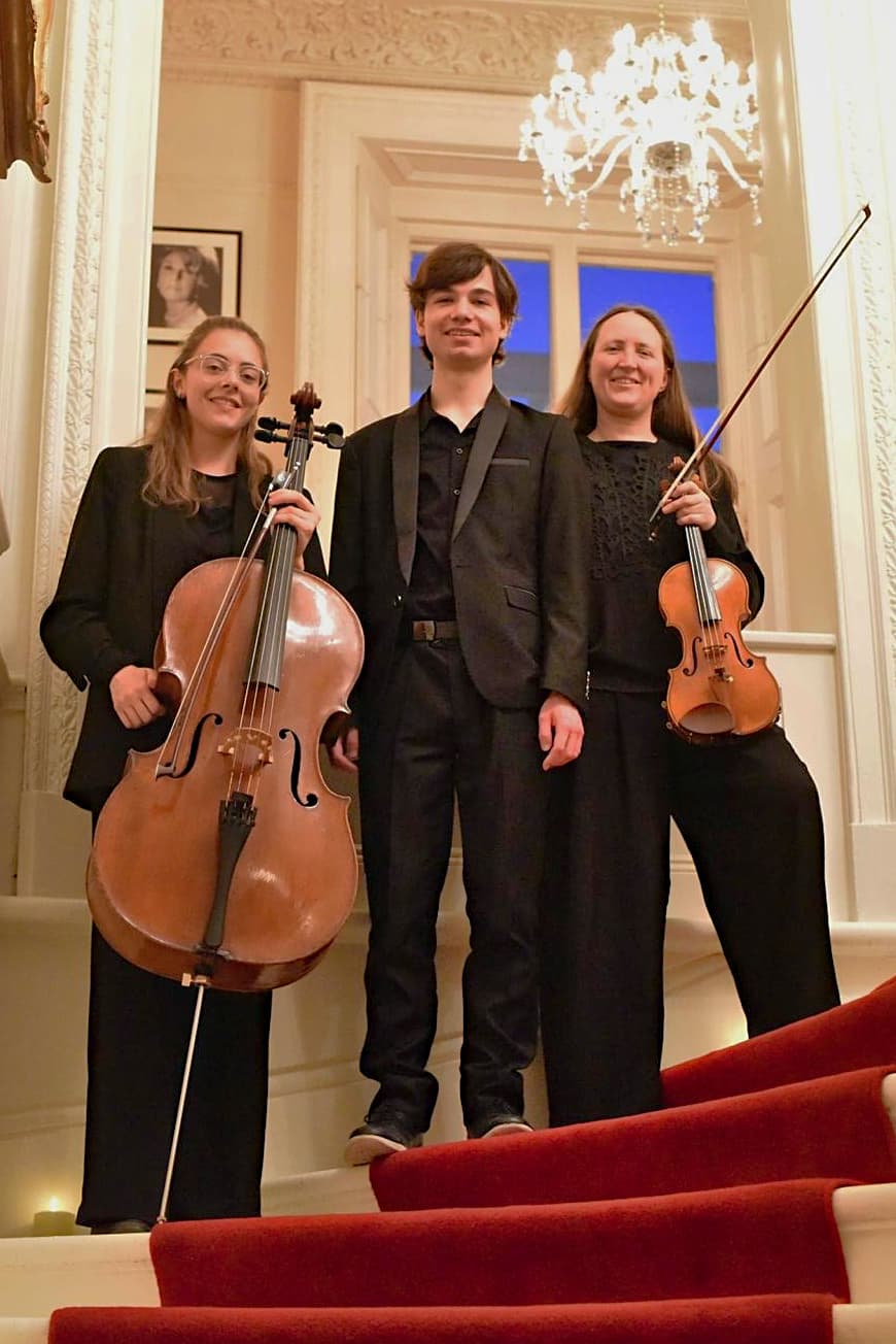 Sophie and her trio on the stairs at the Polish Hearth Club